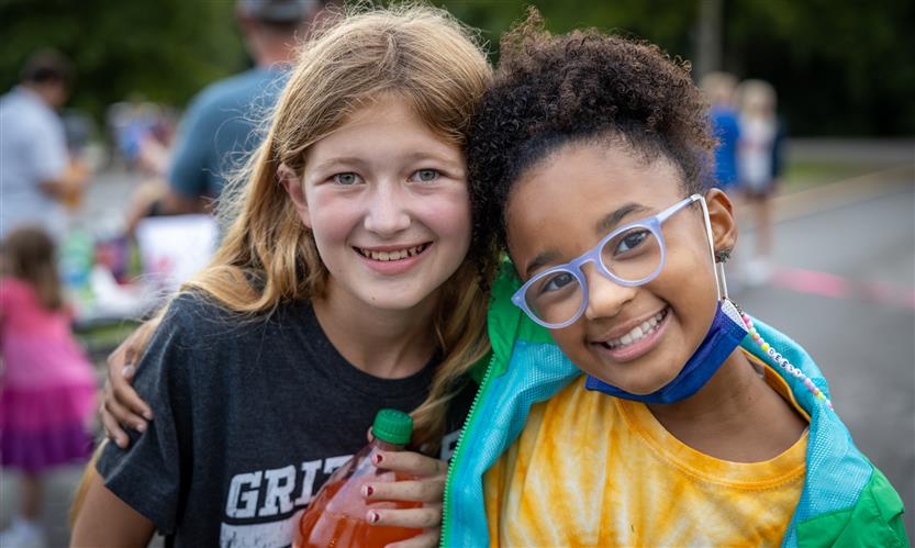 Two girls smile